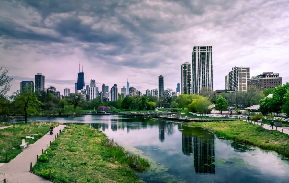 river-near-city-buildings-under-cloudy-sky-1209978