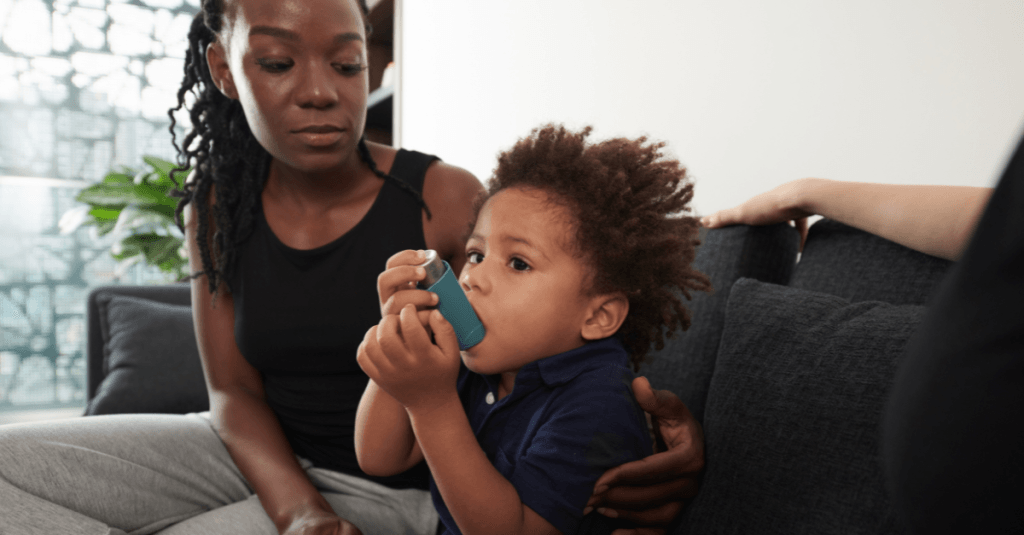 Child using inhaler due to air pollution
